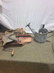 lot 246 image: Vintage Hand-Crank Corn Sheller and Metal Watering Can