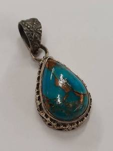 Sterling Silver Turquoise Pendant with Intricate Design