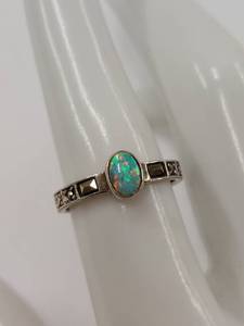 lot 15Q image: Sterling Silver Opal Ring with Detailed Band Design