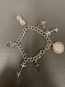 lot 134Q image: Sterling Silver Charm Bracelet, Tested