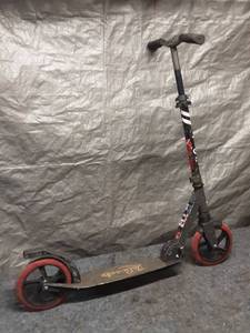 lot 93 image: Used Foldable Kick Scooter with Red Wheels