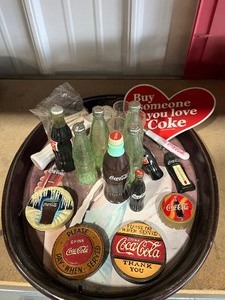 lot 56 image: Coke Serving Trays   with a bunch of little coke items
