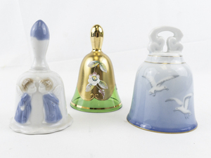 lot 266 image: Group of Three Bells Moser Bohemian Crystal Czechoslovakia Handmade Heavy Gold Glint Dinner Bell, BING & GRONDAHL Seagull Bell. & TREASURE MASTERS Angels Kissing Bell.
