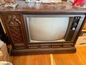 lot 84 image: Vintage RCA XL-100 Solid State Console TV with Wood Cabinet