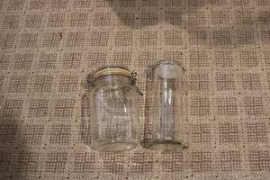 lot 525 image: 2 glass storage jars...