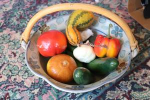 lot 560 image: Pottery basket with fruit...