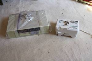 lot 568 image: Mountable can opener and radio...
