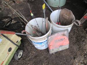 lot 7 image: Ice fishing rods, scoop and other a...