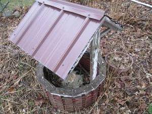 lot 42 image: Decorative garden wishing well...