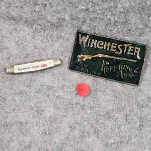 lot 5 image: Winchester Belt Buckle and Trojan Seeds Knife