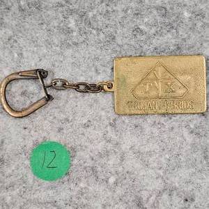 lot 12 image: Trojan Hybrid Brass Keychain