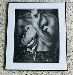 lot 69 image: Framed Print by Jan Saudek in Black and WhiteTheatre of Life Man holding a baby