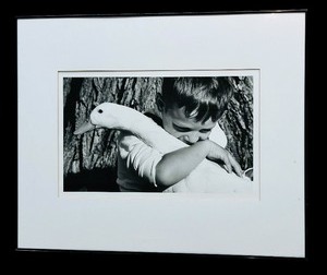 lot 67 image: Large Black and White Framed Photographic Print of a Boy with a Goose