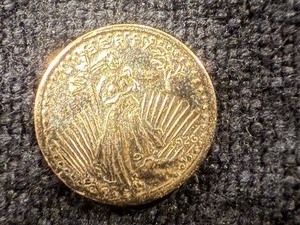 lot 106 image: Saint Gaudens .5 grams Miniature Coin