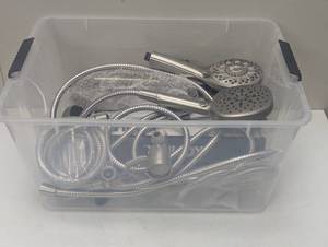 lot 14 image: Bin full of Kohler Shower Wands and Parts