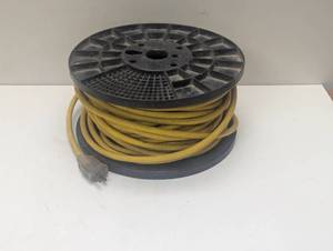lot 16 image: Heavy Duty 12-3 Extension Cord On Roll - Yellow