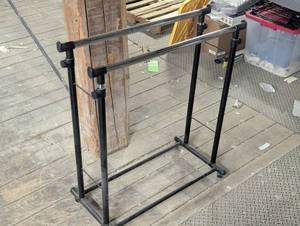 lot 26 image: Double Rod Clothes Rod - Adjustable and on Casters