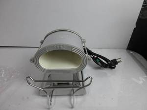 lot 115 image: Annie Ceramic Thermal Stove Large Silver HEATS UP, SLIGHTLY USED
