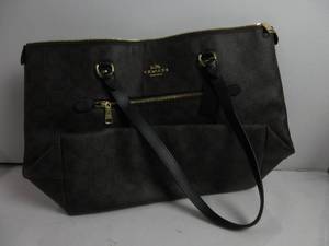 lot 141 image: Coach Gallery Tote In Signature Canvas BrownBlack HAS A SLICE ON FRONT AND BOTTOM, LIKE NEW