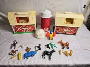 lot 55 image: Vintage Fisher-Price Little People Play Farm Barns and Sile with Figures
