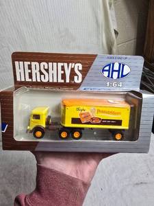 lot 61 image: Hersheys 164 Scale Reeses Peanutritious Mack Model CJ Truck
