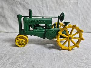 lot 63 image: Vintage John Deere Cast Iron Toy Tractor with Metal Wheels