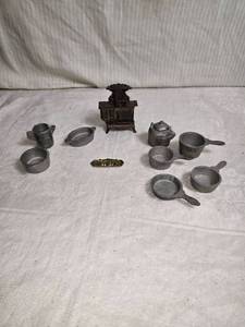 lot 67 image: Miniature Cast Iron Vintage Stove with Cooking Utensils Set