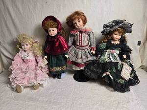 lot 88 image: Lot of 4 Collectors Edition Porcelain Dolls with Vintage Clothing