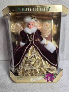 lot 125 image: 1996 Special Edition Holiday Barbie Doll in Burgundy and Gold Dress