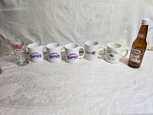 lot 179 image: Commemorative Mugs and 1 A&W Root Beer Bottle