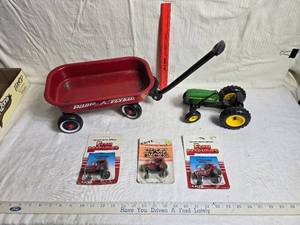 lot 238 image: SMall Radio Flyer Miniature Wagon and Die-Cast Tractor Set