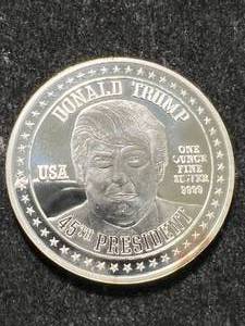 lot 84 image: 1 TROY OZ .999 FINE SILVER DONALD TRUMP ROUND