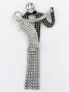 lot 286 image: Butler & Wilson  Crystal Dancing Couple Silver Tone Base Metal Brooch .