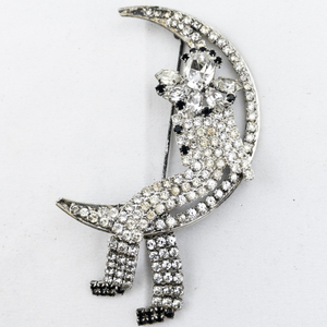 lot 289 image: Butler & Wilson  Man On The Moon Rhinestone Silver Tone Base Metal Brooch .