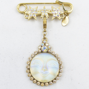 lot 294 image: Kirks Folly Seaview Moon Star Gold Tone Base Metal Brooch .
