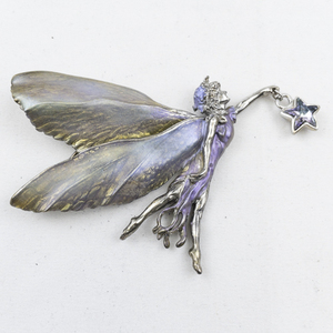 lot 296 image: Kirks Folly Astral Fairy Silver Tone Base Metal Brooch .