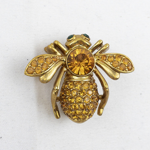 lot 298 image: Joan Rivers Citrine Crystal Pave Gold Tone Base Metal Brooch .