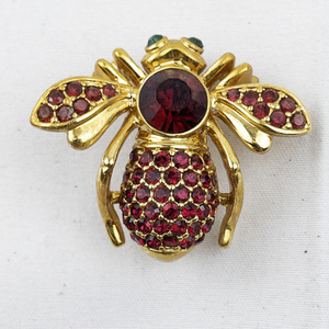 lot 300 image: Joan Rivers Ruby Red Crystal Pave Gold Tone Base Metal Bee Brooch.