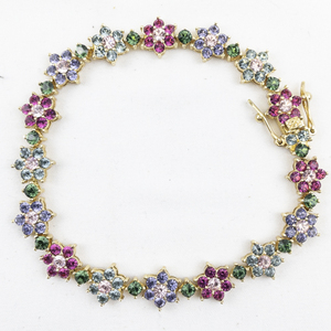 lot 435 image: Joan Rivers Multi-Colored Crystal Flower Gold Tone Base Metal Tennis Bracelet.