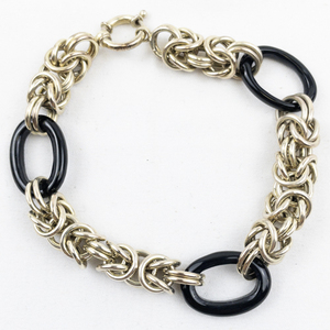 lot 436 image: Black Gold Tone Base Metal Link Bracelet.