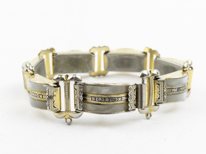 lot 438 image: Mother Of Pearl Two-Tone Base Metal Panel Bracelet.