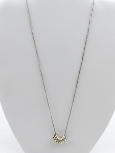 lot 534 image: Seven Ring Tri-Tone Sterling Silver Pendant Necklace .