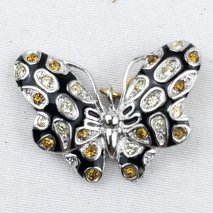 lot 300D image: Nolan Miller Orange & White Rhinestone Accented Enameled Butterfly silver tone Base Metal charm.