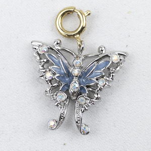 lot 300G image: Nolan Miller Blue Enamel Butterfly silver tone Base Metal charm.