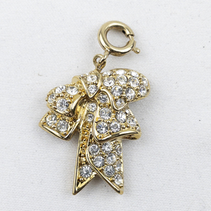 lot 300K image: Nolan Miller Rhinestone Accented gold tone base metal charm.