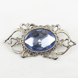 lot 390 image: Blue Rhinestone Silver Tone Base Metal Brooch .