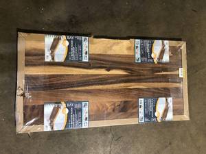 lot 36 image: Hampton Bay 4 ft. L x 25 in. D Finished Saman Solid Wood Butcher Block Standard Countertop in with Live Edge     Customer Returns See Pictures