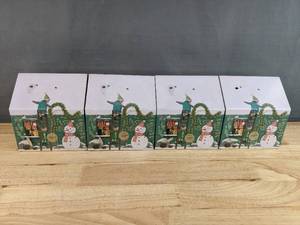 lot 345 image: 4 New M & S Foods Chocolate Chip Stars Santas Workshop Musical Light Up Tin N