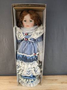 lot 110 image: New 1st Impressions Porcelain Doll with Light Blue Dress B