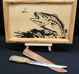lot 25 image: LARGE RAPPALA FILLET KNIFE AND FRAMED WOODEN ART FISH SCENE